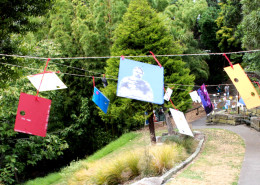 Postcards made by the artist flew from lines across the walking path.